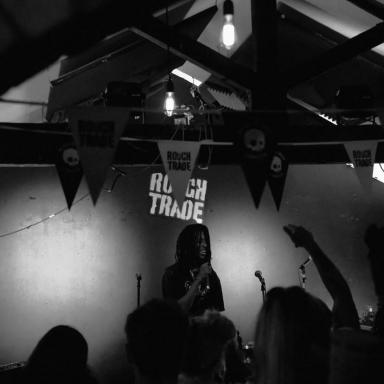 odox performing infront of a crowd at Rough Trade record shop